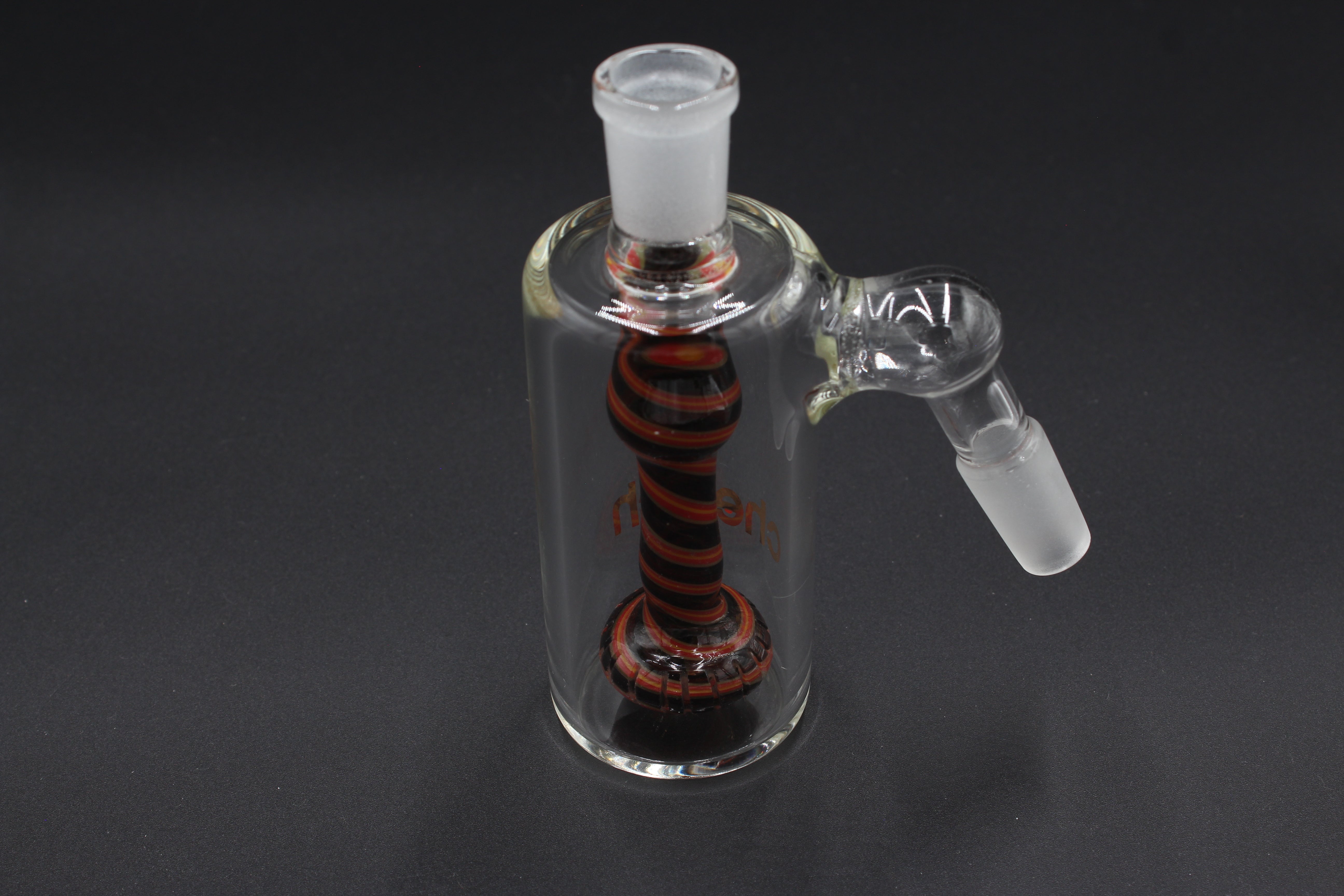 Cheech Glass 14mm 45° Orange/Black Spiral Ashcatcher to the right